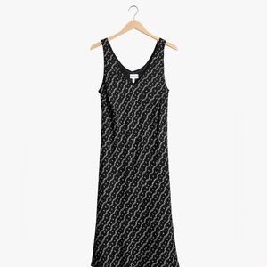 A Wild Thyme Size 16 sleeveless lined black dress with geometric pattern